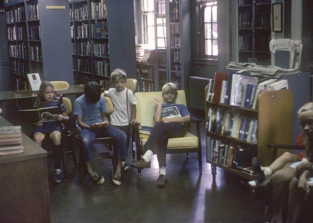 Children reading at story time