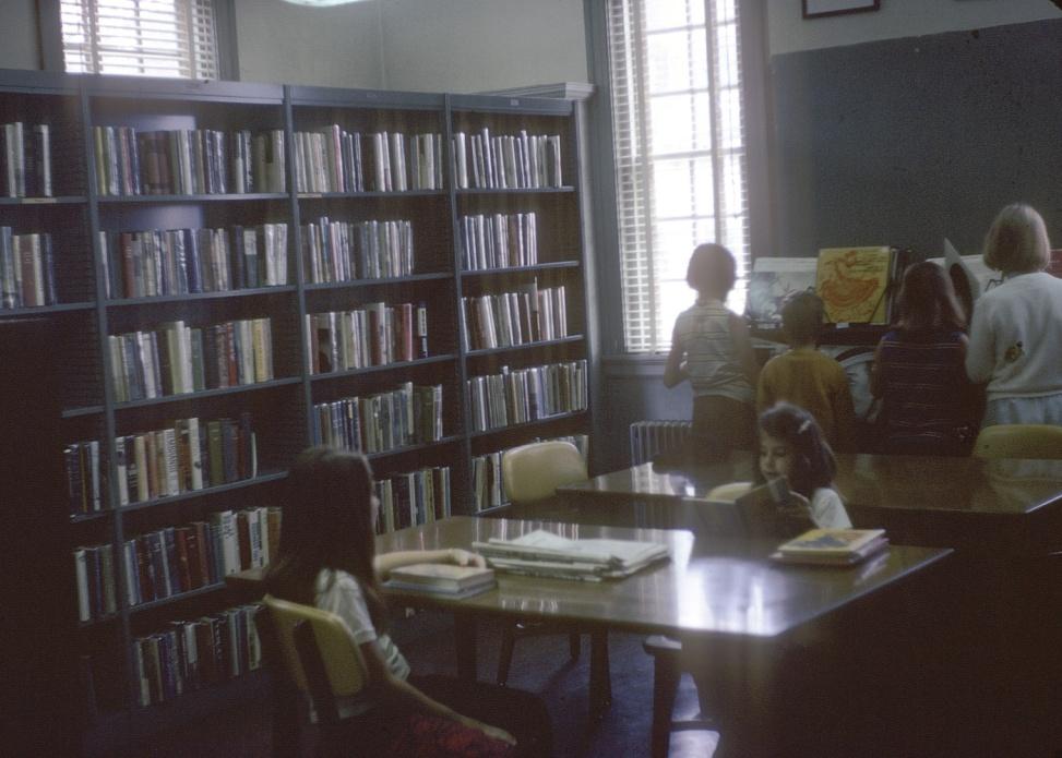 Children reading at table